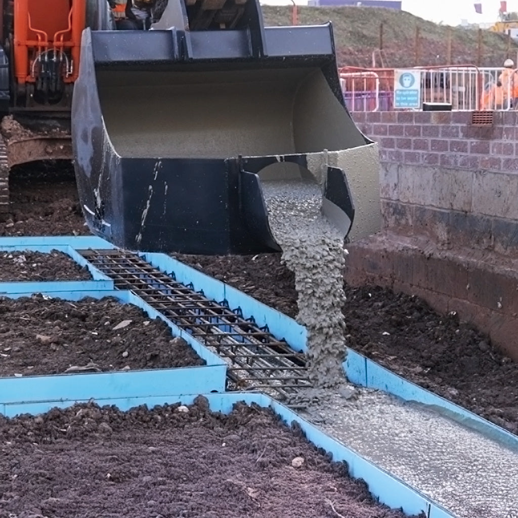 XCMG XE80U Concrete Pouring Bucket pouring into foundation trench