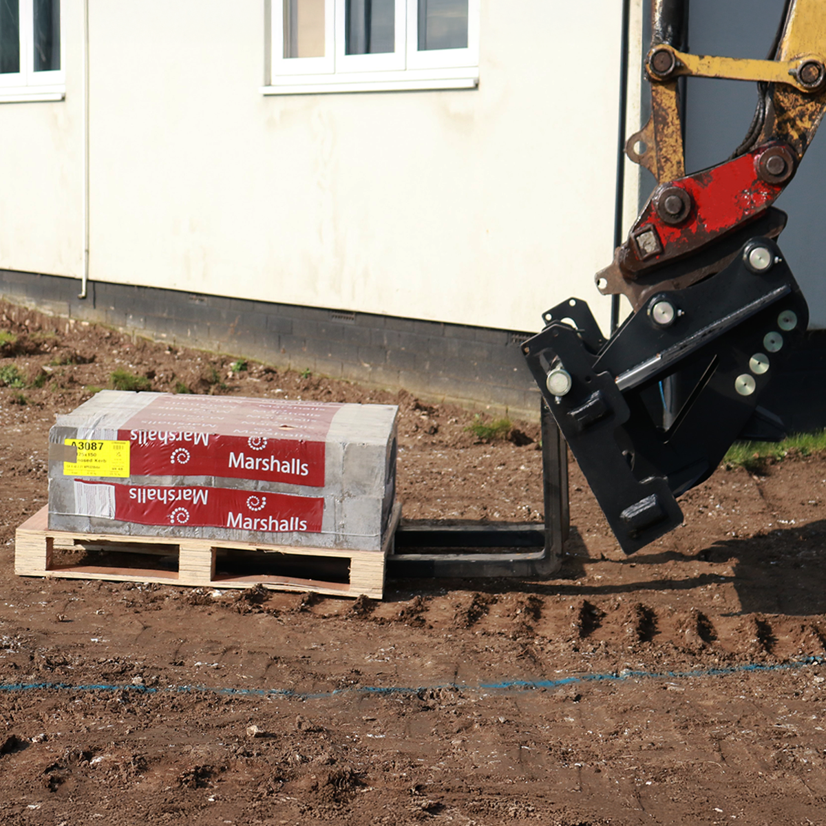 Takeuchi TB2150 Pallet Forks Lifestyle Image 1